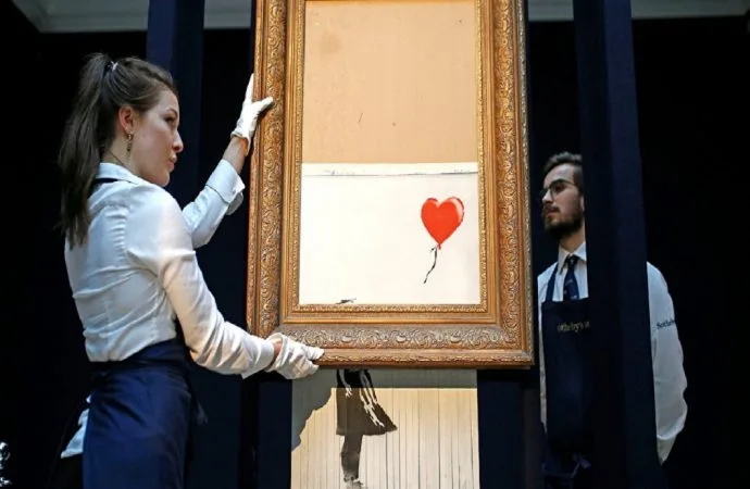 2018’e damga vuran 12 fotoğraf ve çağrıştırdıkları sanat eserleri 1 banksy parcalanan eser 690x450 jpg