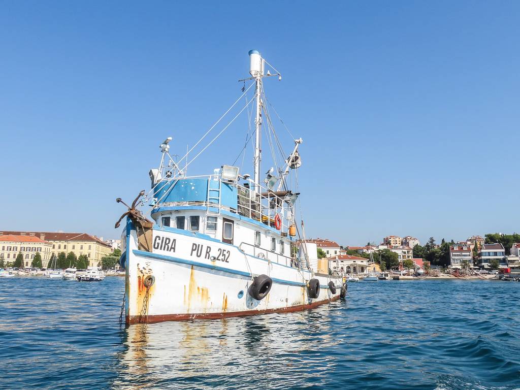 ship sailing in water with blue skies