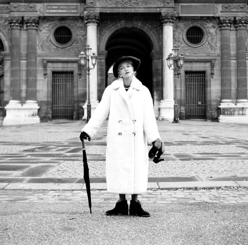 Model having fun at the end of the fashion shoot Ready to wear Louvre Paris c1950. © Marilyn Stafford