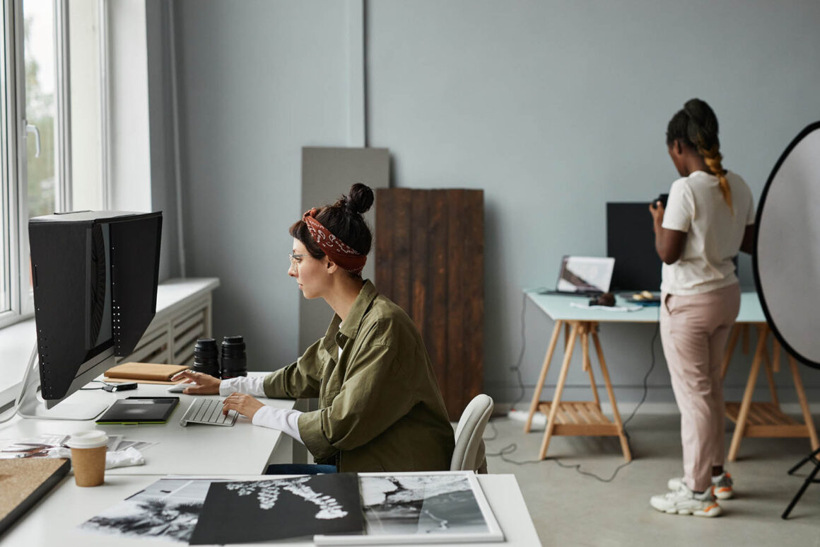 photographer at desk in studio