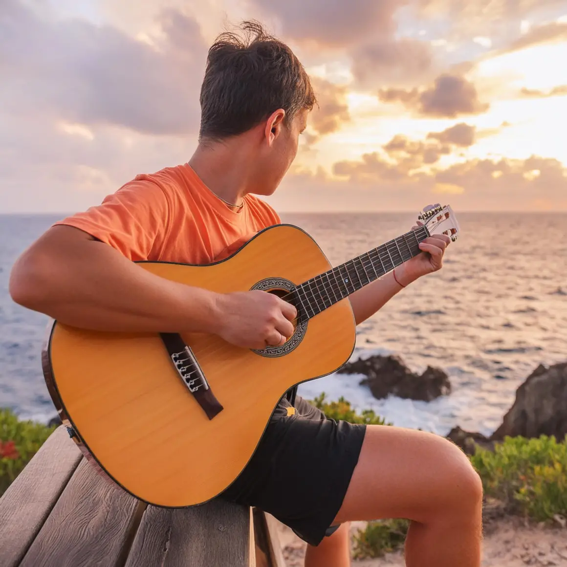 Man playing an acoustic guitar by ocean at sunset prompt output 2