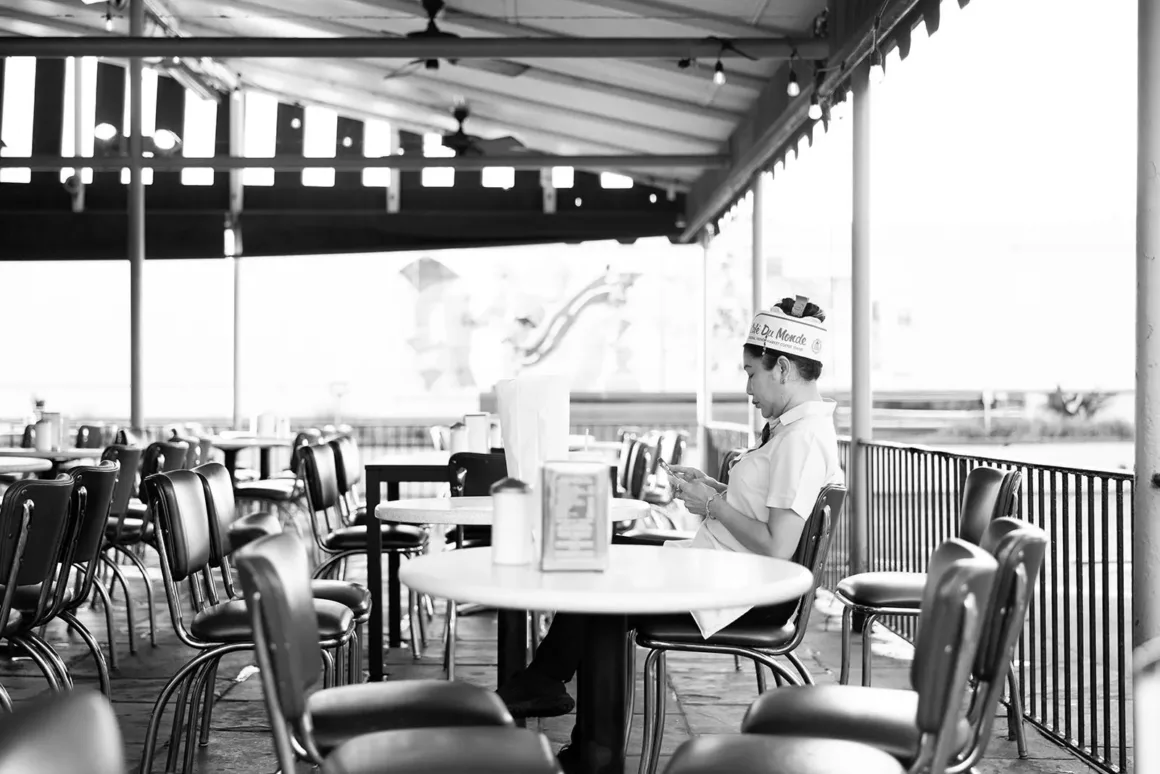 23 Aric Becker Quiet Time Employee Takes a Minute Before Opening Time Hi Res