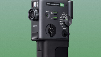 a fujifilm hybrid camera is on a green background