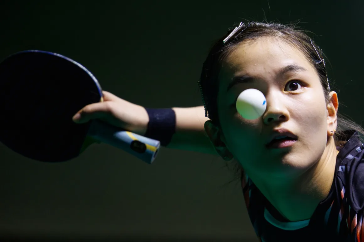 a ping pong ball is in front of a players eye