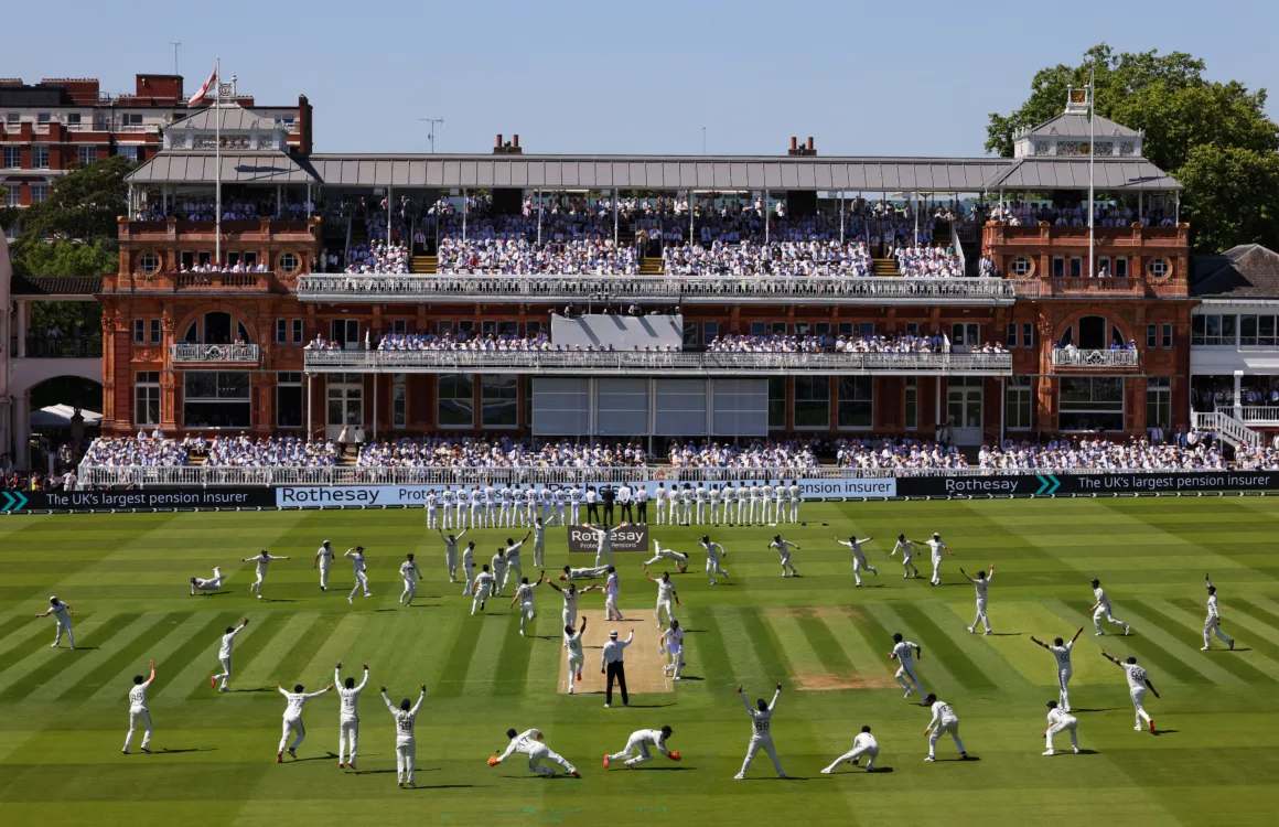 cricket players stretch and warm up in front of stands