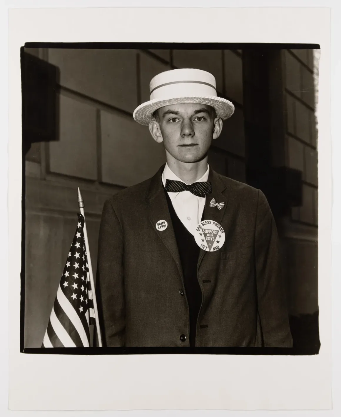Boy with a Straw Hat Waiting to March in a Pro War Parade