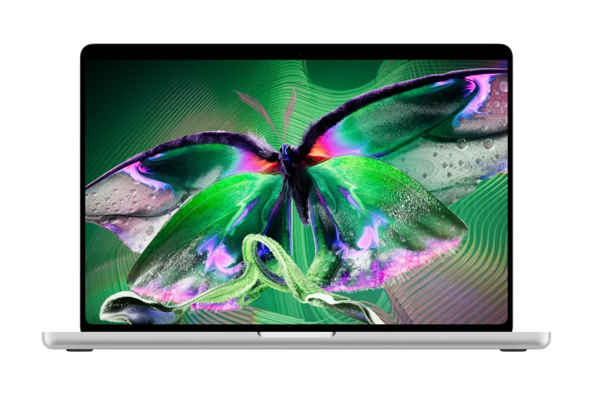 Apple’ın İlk Dokunmatik OLED MacBook Pro’su Tanıtıldı 23 A silver laptop with a thin-bezel screen displaying a vibrant, green-toned digital butterfly graphic.