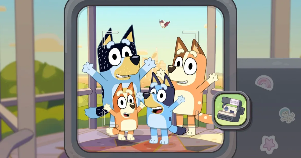 A digital camera screen displays a photo of the Heeler family—Bandit, Chilli, Bingo, and Bluey—posing together outdoors with a bird flying in the background.