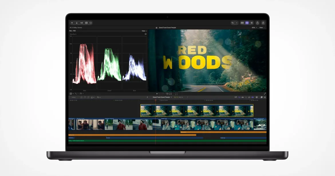 A laptop screen displays a video editing software interface featuring a waveform monitor, a video preview of a forest scene with the text "RED WOODS," and a multi-track timeline.