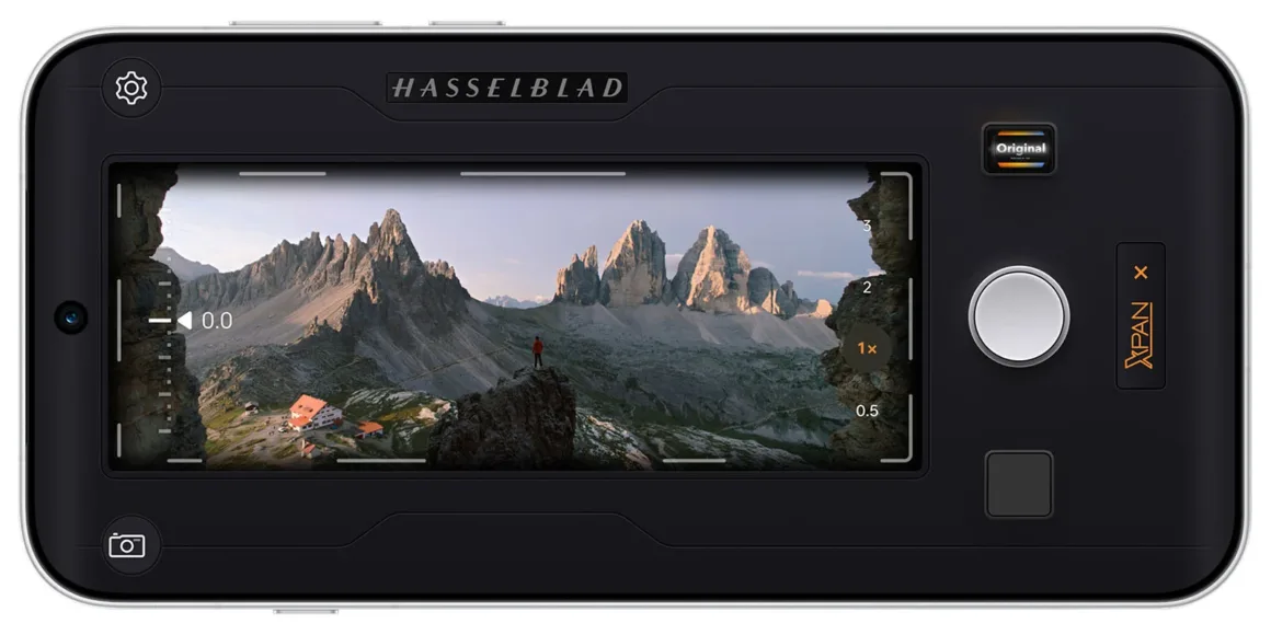 Oppo Find X10 Pro Max: Dünyanın İlk Üçlü 200 MP Kameralı Telefonu 27 Akıllı telefon arayüzünde dağlardan oluşan geniş açılı bir manzara fotoğrafı gösteriliyor; Hasselblad logosu ve XPan modu ayarları ekranda görülüyor.