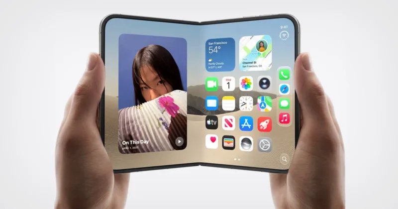 Apple iPhone Duo: İlk Katlanabilir iPhone 7,6 İnç Ekranla Geldi 6 A person holds a foldable smartphone displaying an iOS-style home screen with widgets and app icons against a desert background.